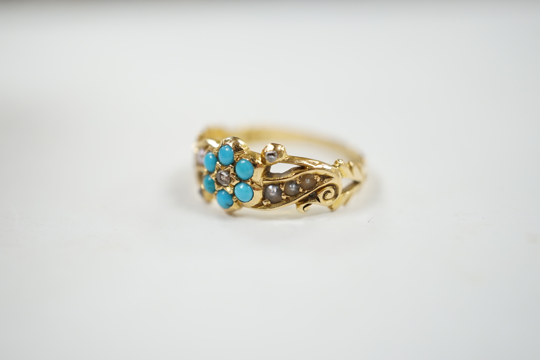 A late Victorian yellow meal, turquoise, rose cut diamond and seed pearl cluster set dress ring, size M, gross weight 3.4 grams.